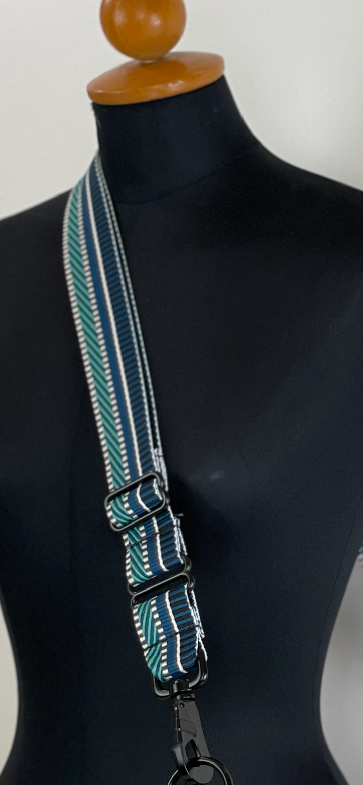 Multi Teal 1 1/2 inch Crossbody Wide Shoulder Straps. Mustkies Replacement Adjustable Purse Straps are a next MUSt have.  Easy snap on and off and adds a POP to your bag. Adjustable Guitar Straps for Handbags.  Adjustable Guitar Straps for Handbags transforms your bags.   Transform Your Bag by updating and customizing it with Mustkies  crossbody wide shoulder webbing straps. 1 1/2  or 2 Inches wide with Black Metal Hardware.