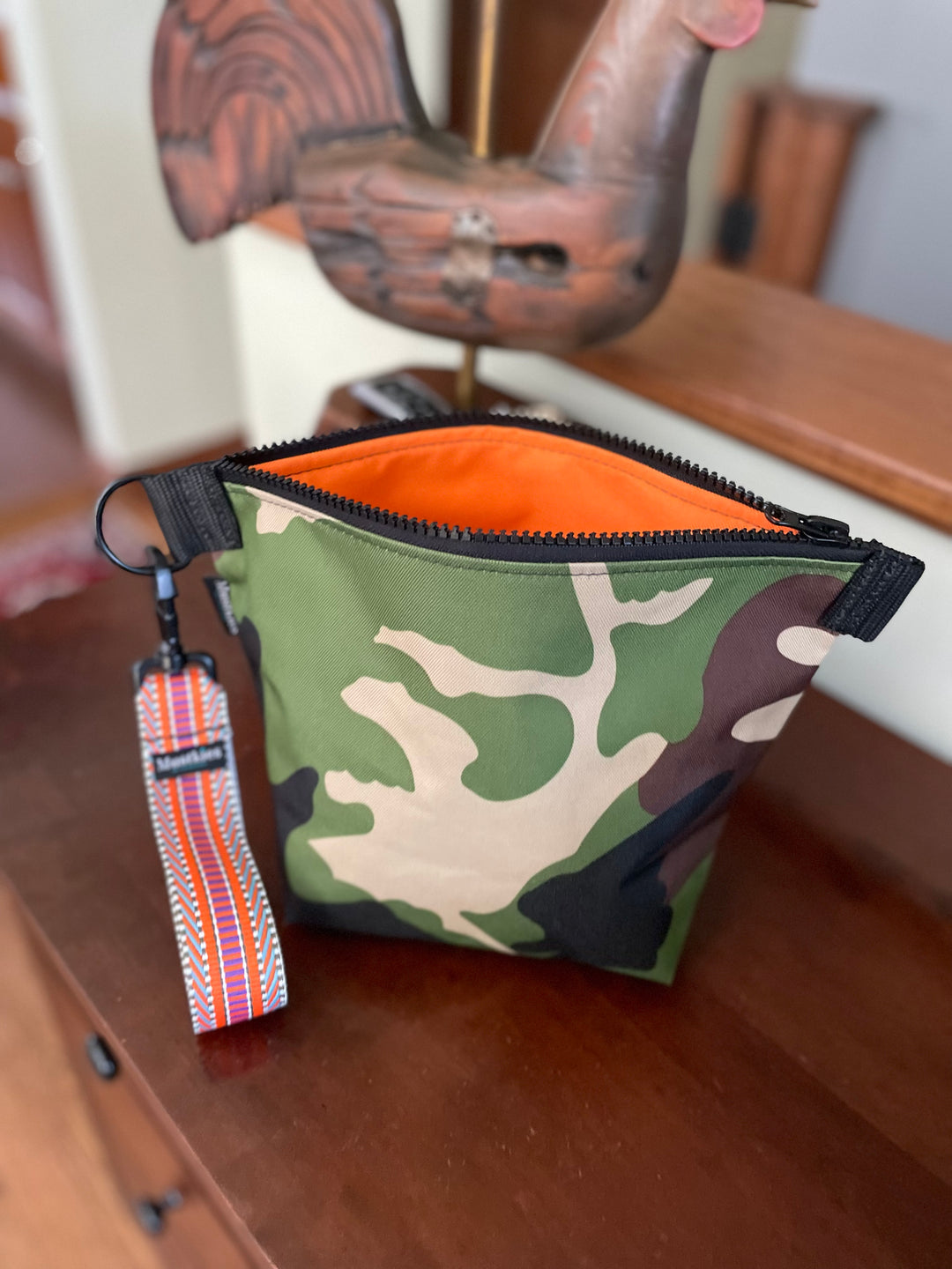 Orange with Camouflage, the perfect combination for Mustkies Voyage Clutch  / cosmetic bag.