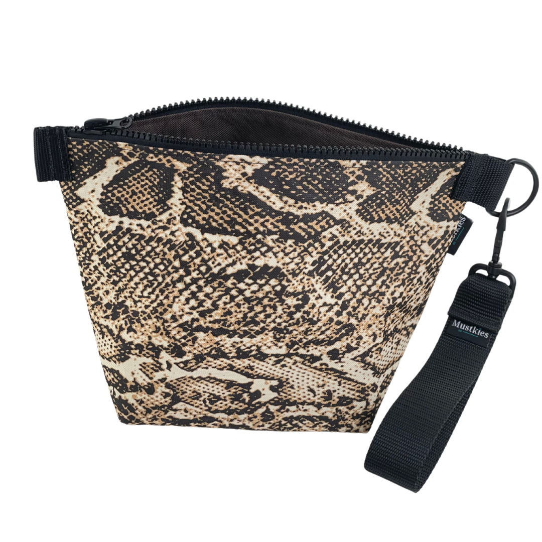 Do you love snake print. This is Mustkies Voyage clutch. A versatile accessory perfect for both cosmetic storage and everyday use as a daytime carry clutch. Handmade in a waterproof canvas inside and out. 