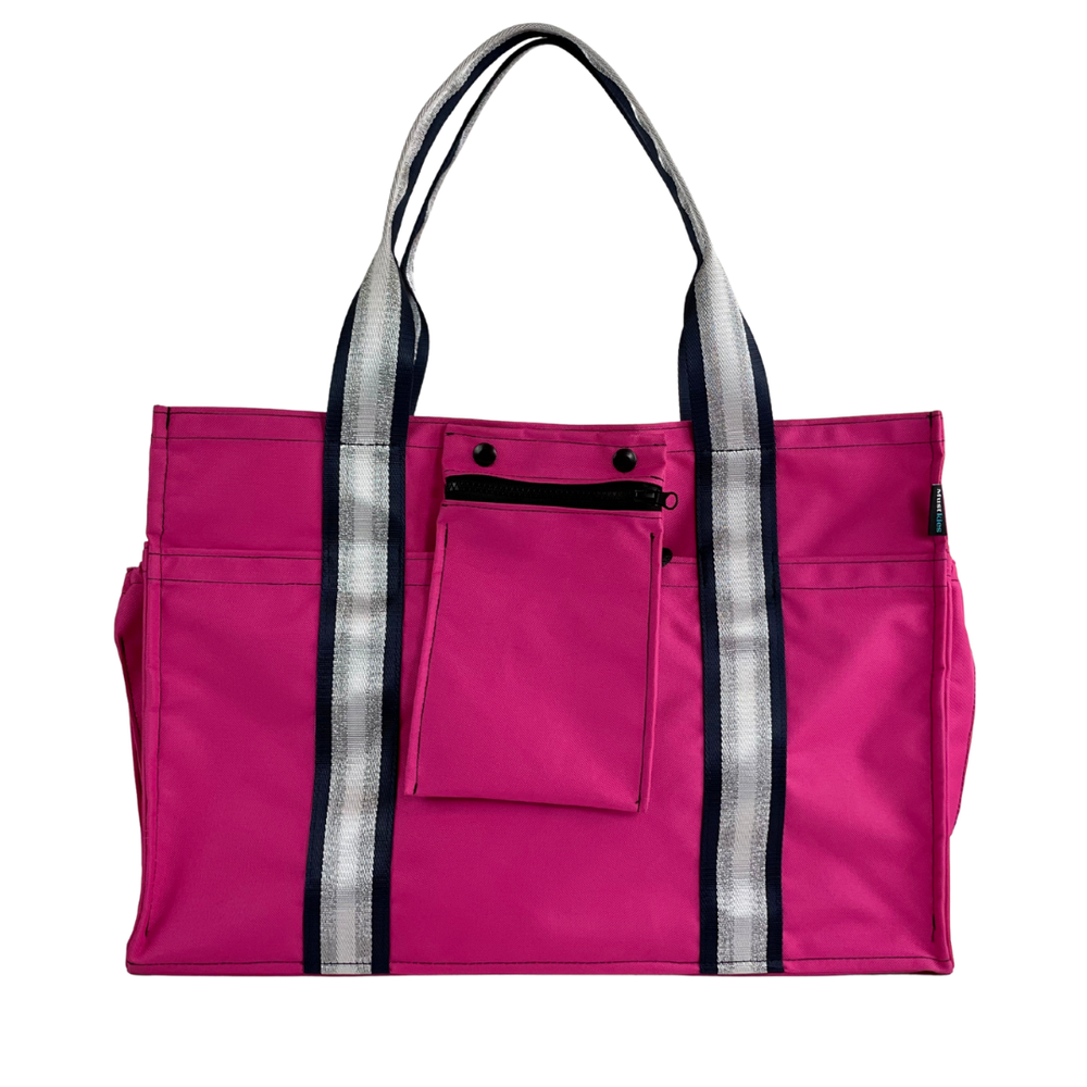Close-up of Mustkies Sydney Tote crafted in a  pink fabric with a silver stripe as a shoulder strap