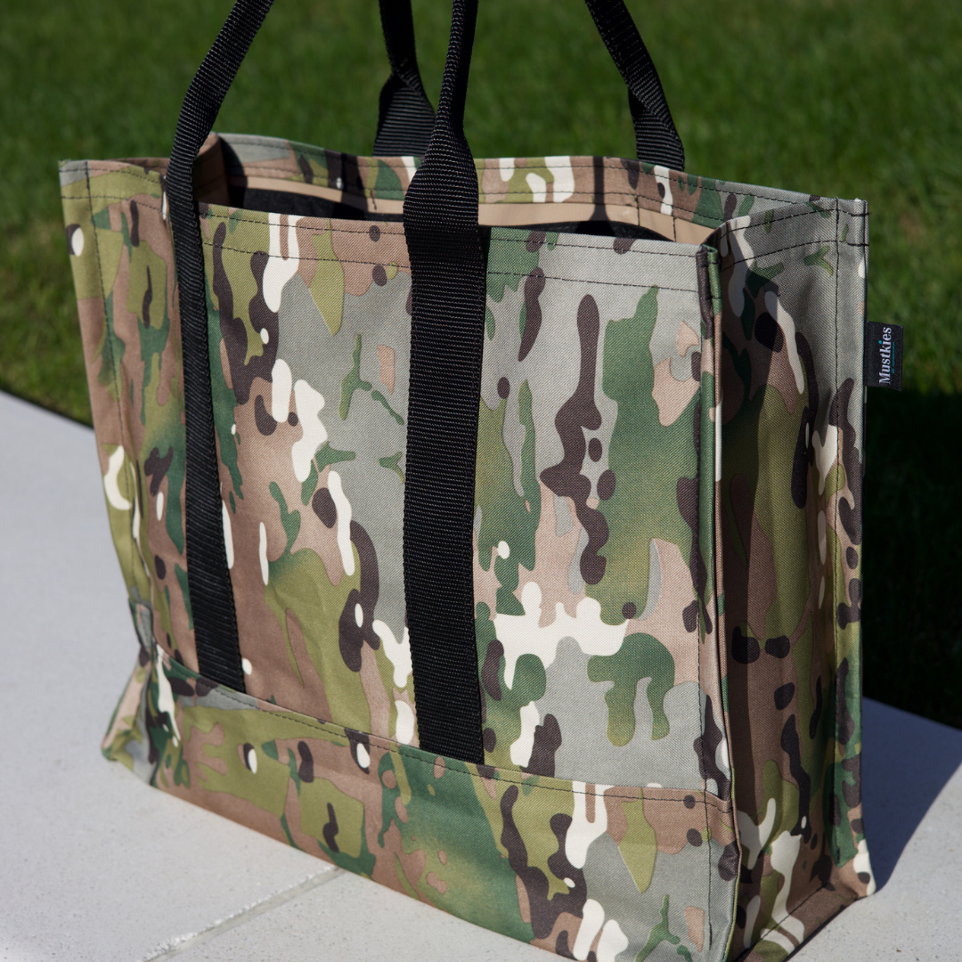 Mustkies CARRIE Tote is your go-to tote. Crafted in a army print waterproof canvas with black lining and black straps. It is a versatile, lightweight everyday bag. Another must-have for running errands, schlepping gear to the kids games, for the beach or even carrying groceries home from the market. White Plains, NY 