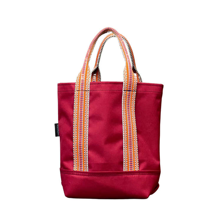 Mustkies LENA Burgundy Small tote with water bottle sleeve inside to secure your water. Finished in a multi color orange strap. Avaliable in 5 colors. Mustkies is a small business located in White Plains NY.  Westchester County.