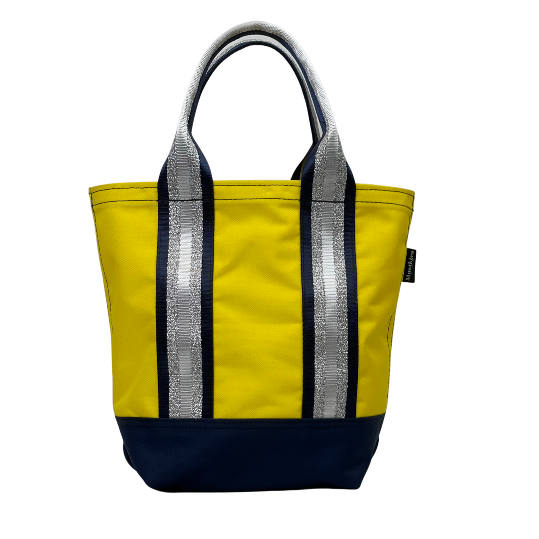 Mustkies LENA Handmade shopper tote for both adults and kids. Crafted in a yellow waterproof canvas. Great for looking stylish and going shopping with mommy/daddy and friends! Lots of room for your accessories and more. Three inside pockets and 1 mask/key holder. Holds against all types of wear and tear and perfect for all types of indoor and outdoor use. The Tote bag is 7.5"L x 5.5 W x 10" Tall. 5" drop. White Plains NY Small Women Owned Business. Westchester County