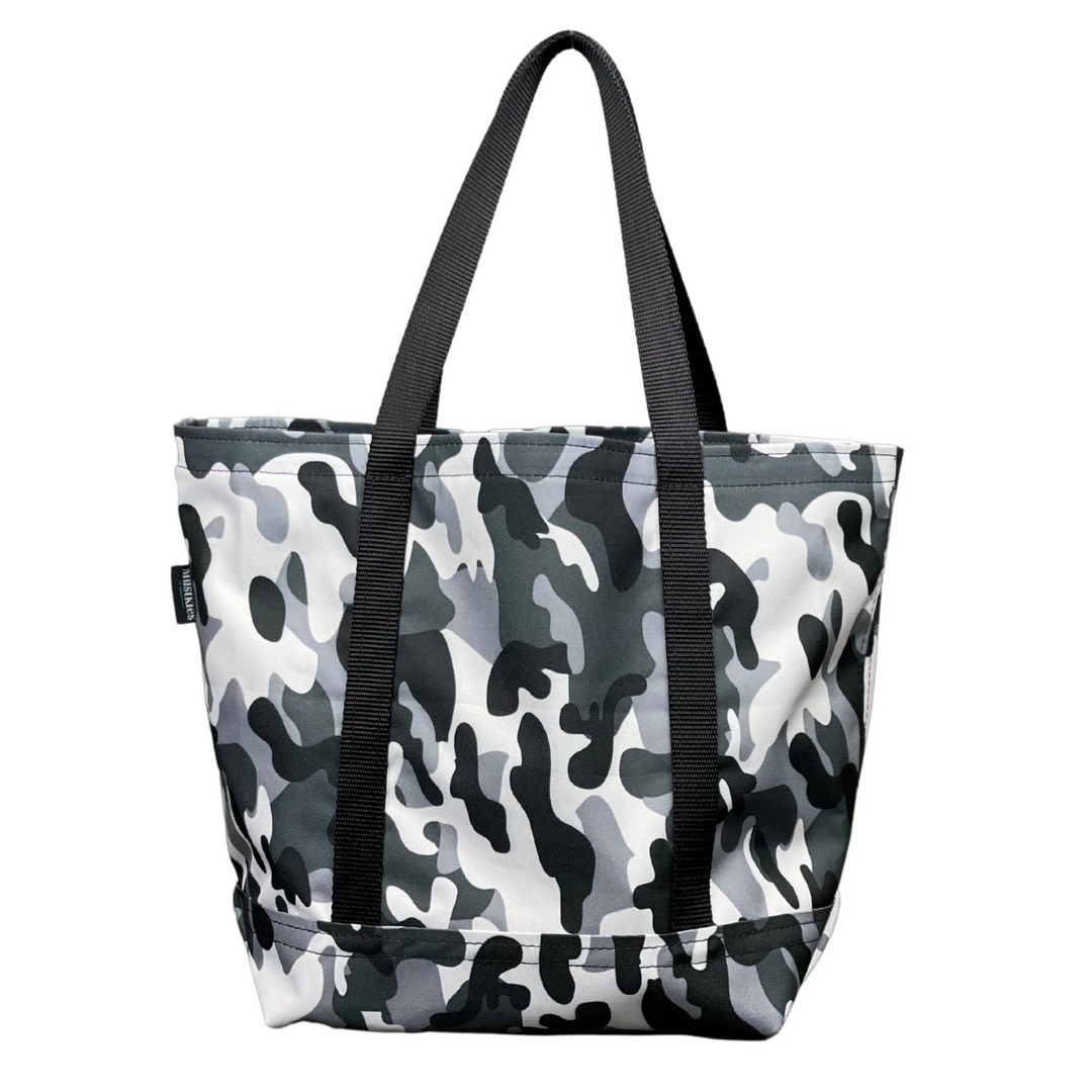 Mustkies Gray Camouflage Waterproof Canvas Milou Shopper Tote with Black Webbing. Ultimate Everyday Shopping Tote Bag. Perfect for running errands. Handcrafted with Waterproof Oxford Canvas, which makes it very easy to clean and finished with a Nylon Rainbow Strap. Available in 6 color options. Finished size 10"L x 8"W x 12"T