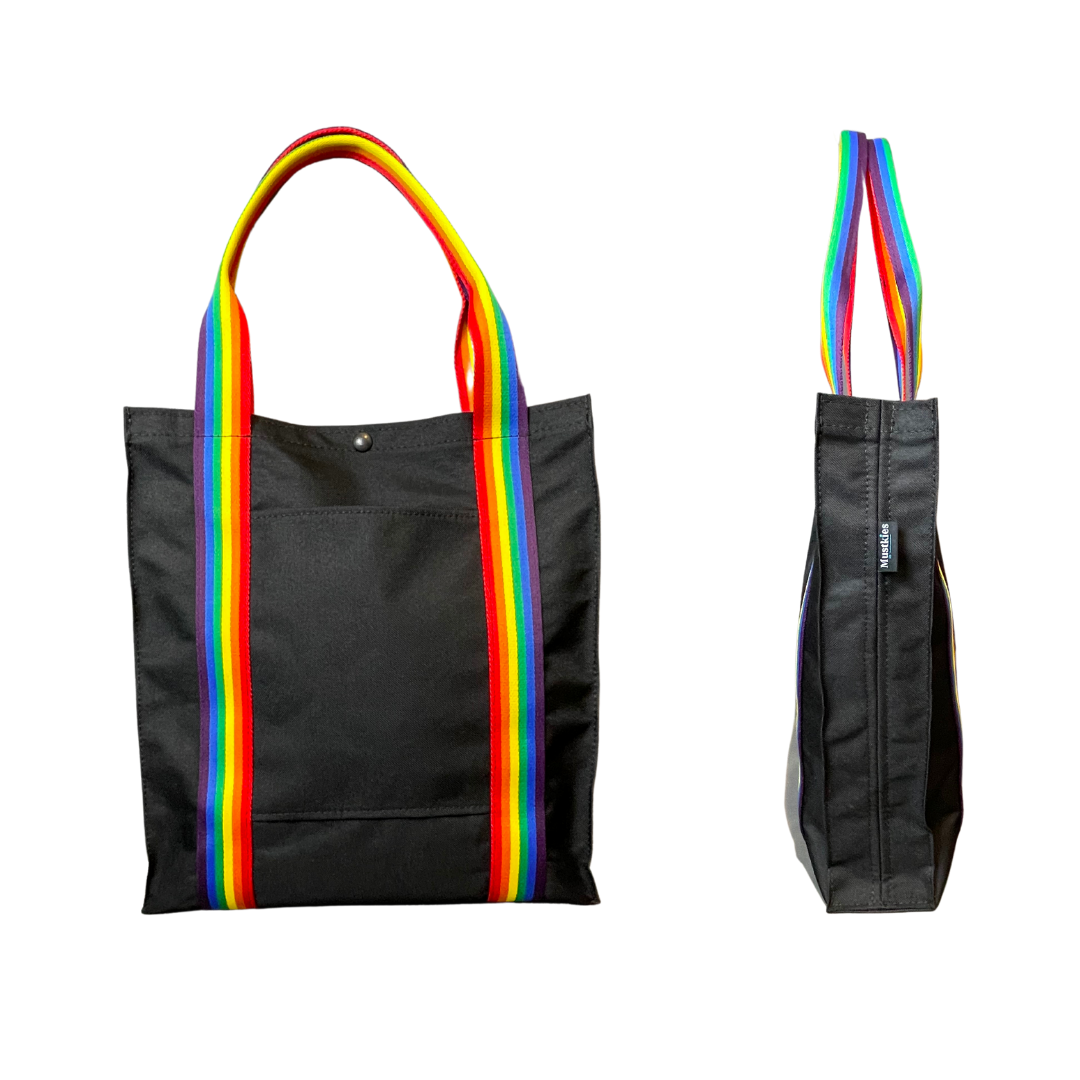 Mustkies PRIDE Black|Rainbow Pride Tote Bag Color Swatch. Ultimate waterproof Canvas Tote Bag that can go almost anywhere. Ultimate waterproof Canvas Tote Bag that can go almost anywhere. Measures 13.5"Lx3"Wx14.5"T. Supporting the LGBT community.