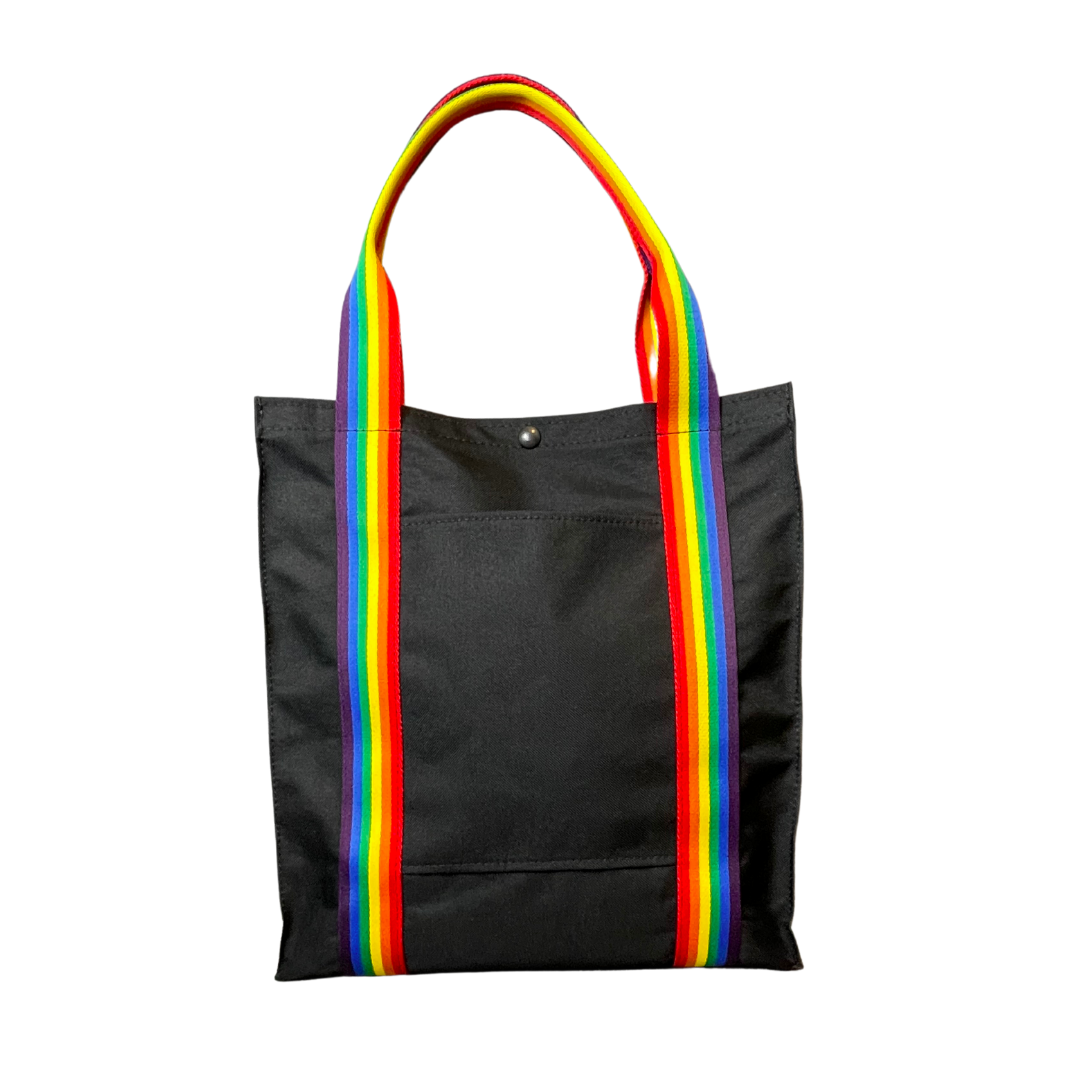 Mustkies PRIDE Black|Rainbow Pride Tote Bag Color Swatch. Ultimate waterproof Canvas Tote Bag that can go almost anywhere. Ultimate waterproof Canvas Tote Bag that can go almost anywhere. Measures 13.5"Lx3"Wx14.5"T Supporting the LGBT community.
